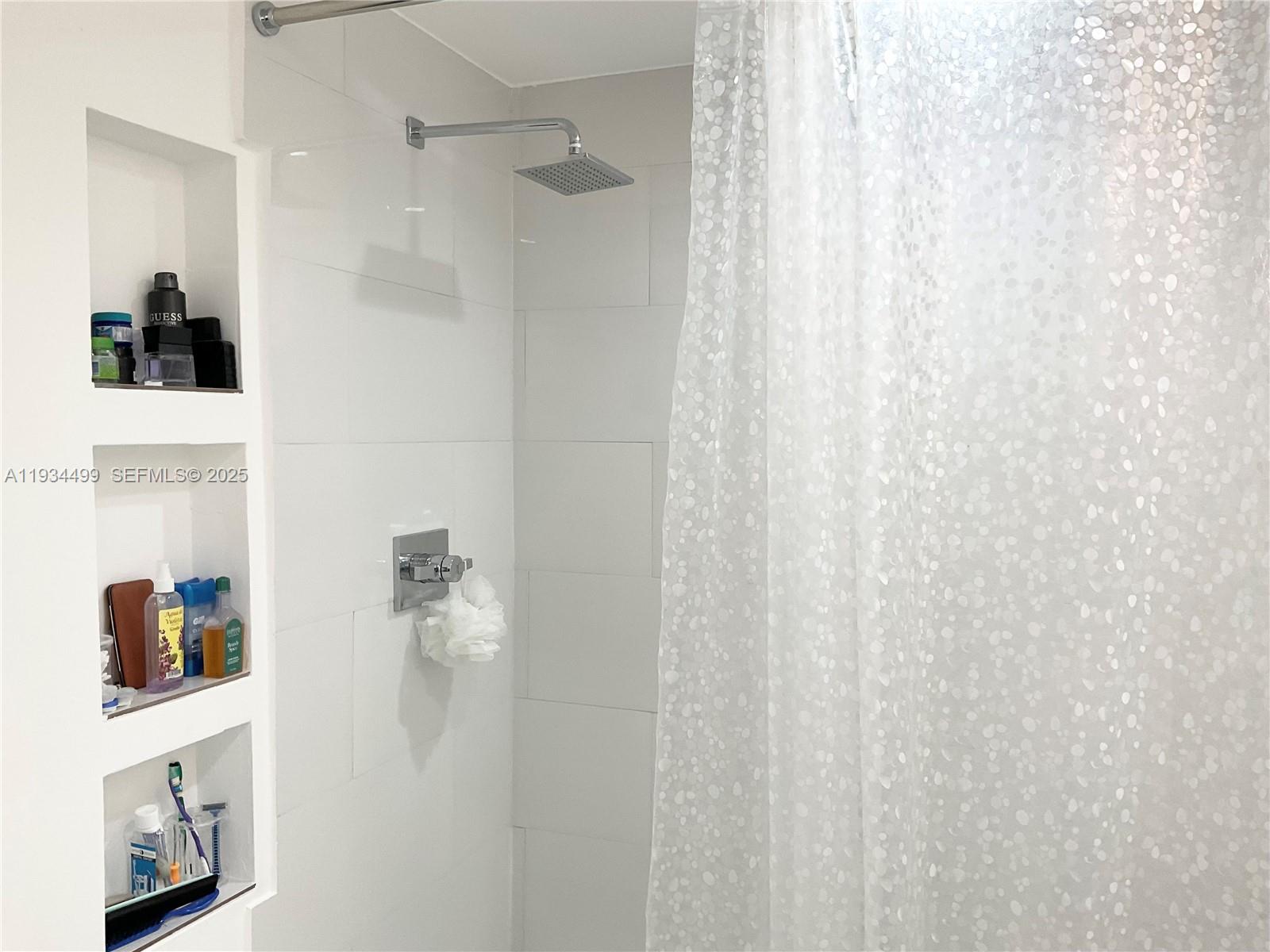 161 Northwest 145th Street Miami, FL 33168 - Photo 14 of 39 a bathroom with a shower