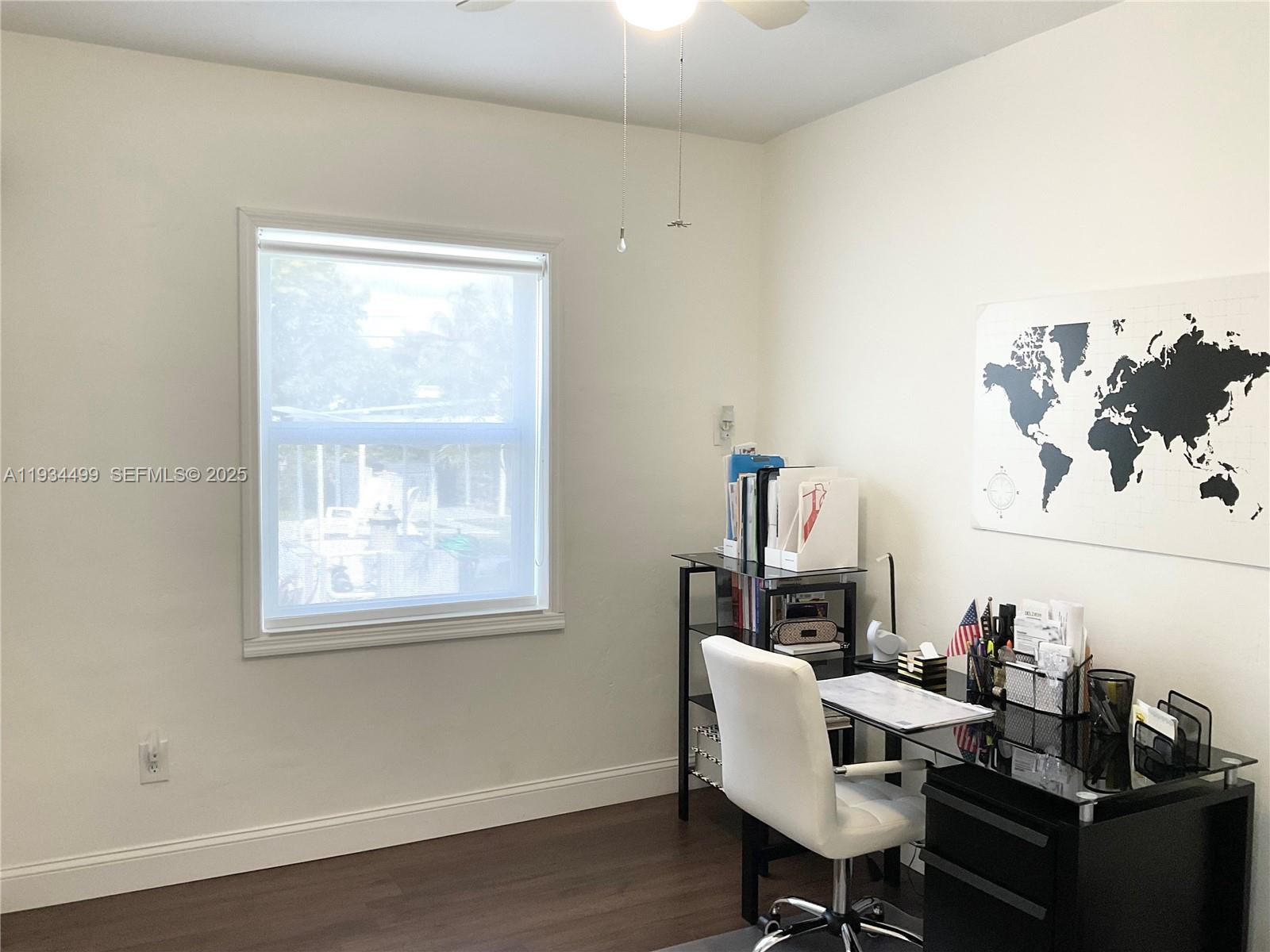 161 Northwest 145th Street Miami, FL 33168 - Photo 15 of 39 a view of a workspace with furniture and a window