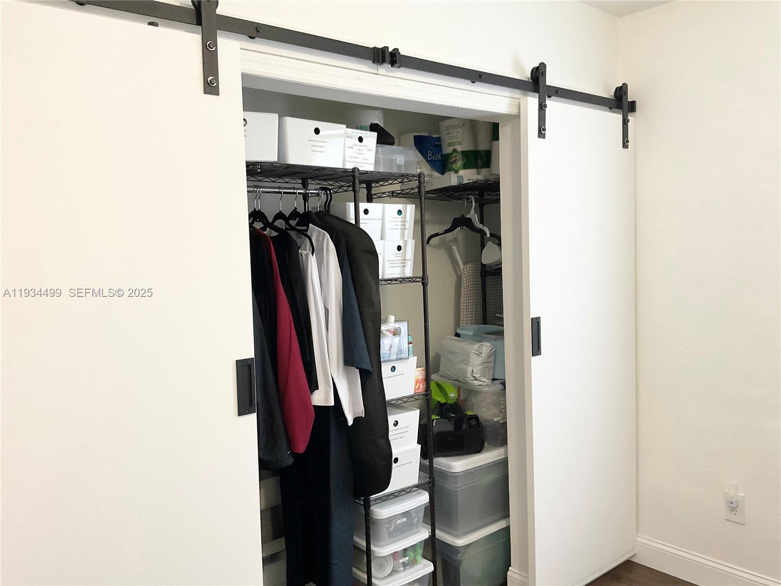 161 Northwest 145th Street Miami, FL 33168 - Photo 16 of 39 a view of walk in closet with clothes and shoes