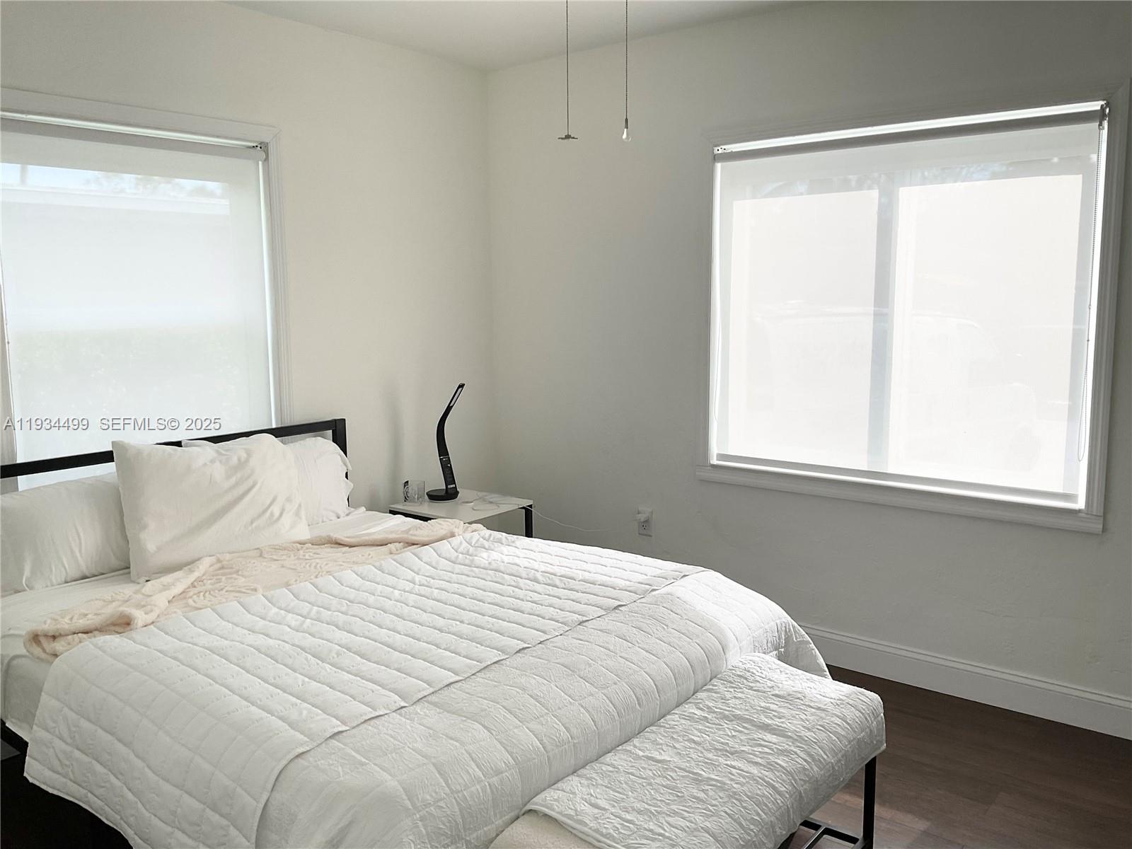 161 Northwest 145th Street Miami, FL 33168 - Photo 20 of 39 a bedroom with a bed and a window