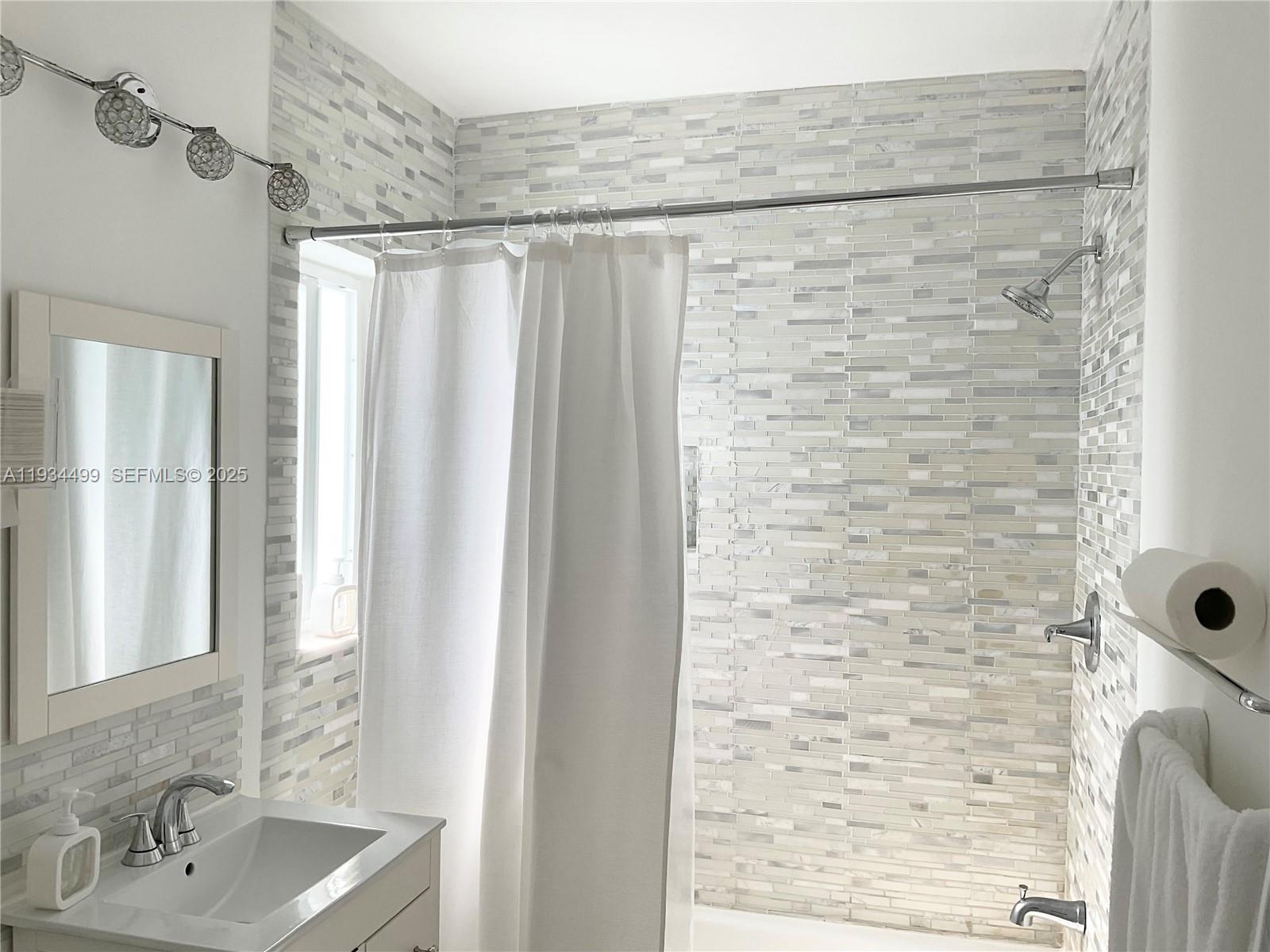 161 Northwest 145th Street Miami, FL 33168 - Photo 25 of 39 a bathroom with a shower and a sink