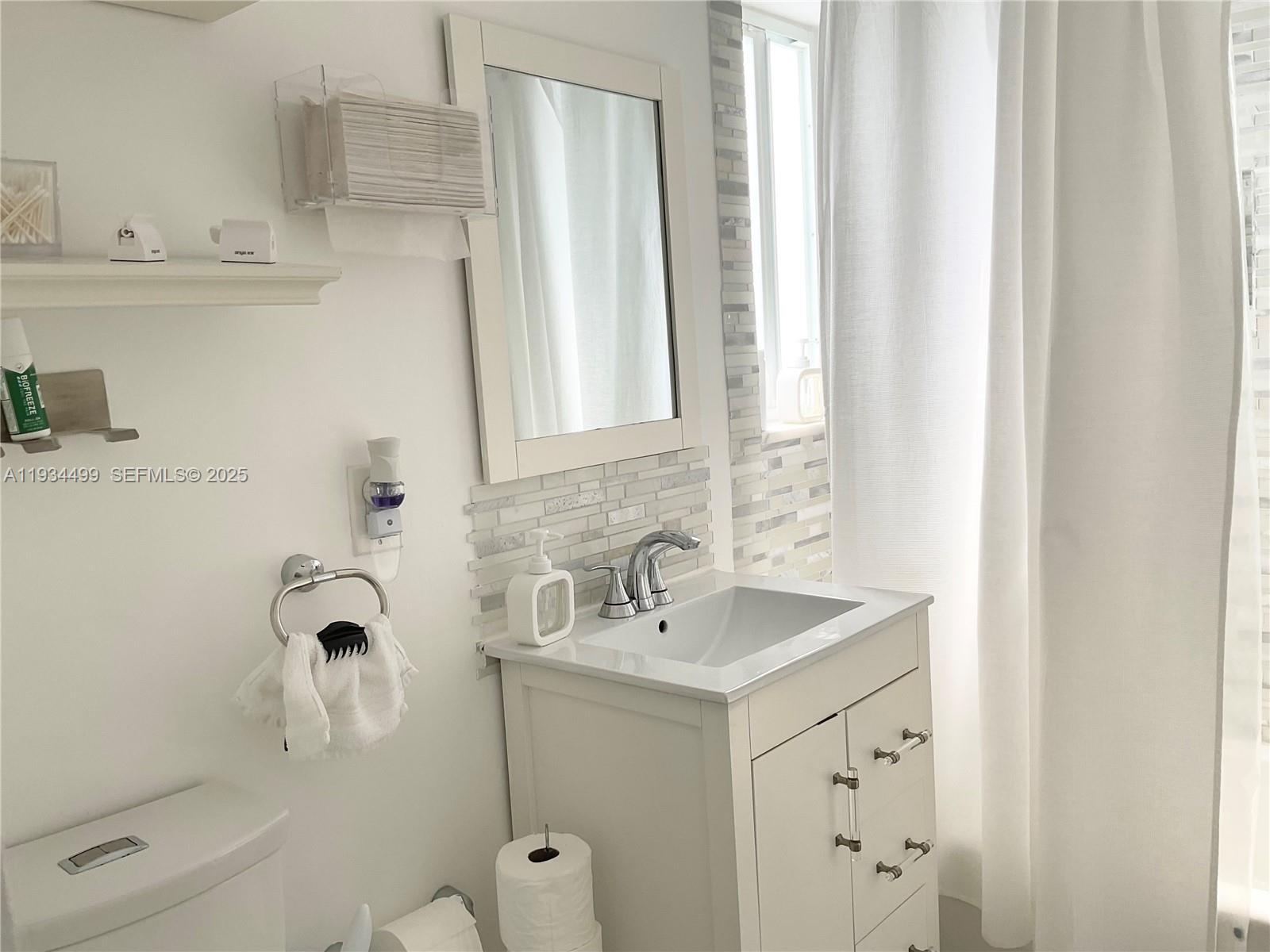 161 Northwest 145th Street Miami, FL 33168 - Photo 26 of 39 a bathroom with a sink a toilet and shower