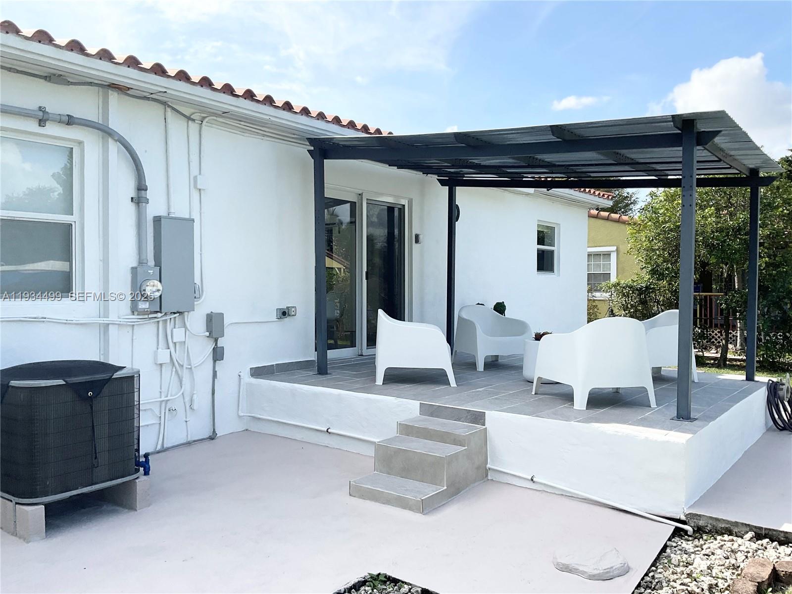 161 Northwest 145th Street Miami, FL 33168 - Photo 28 of 39 a living room with furniture and a large window
