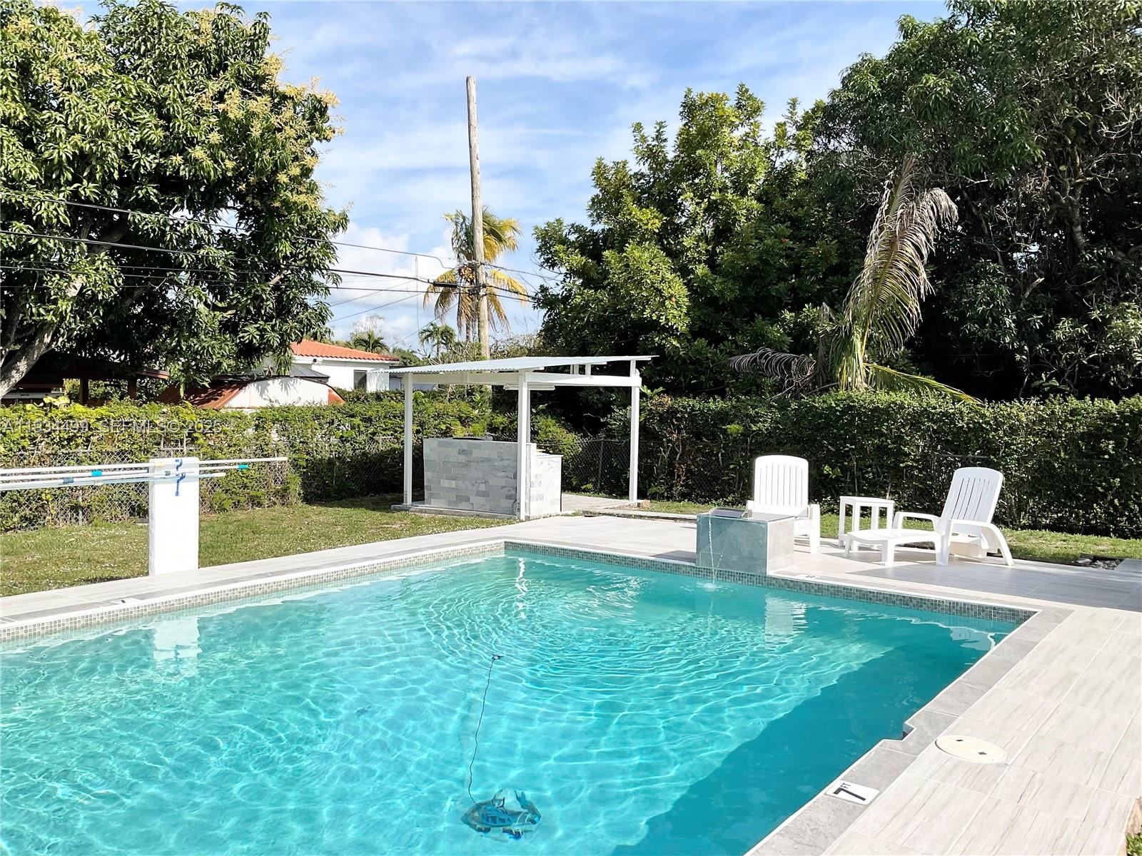 161 Northwest 145th Street Miami, FL 33168 - Photo 32 of 39 a view of a house with a yard