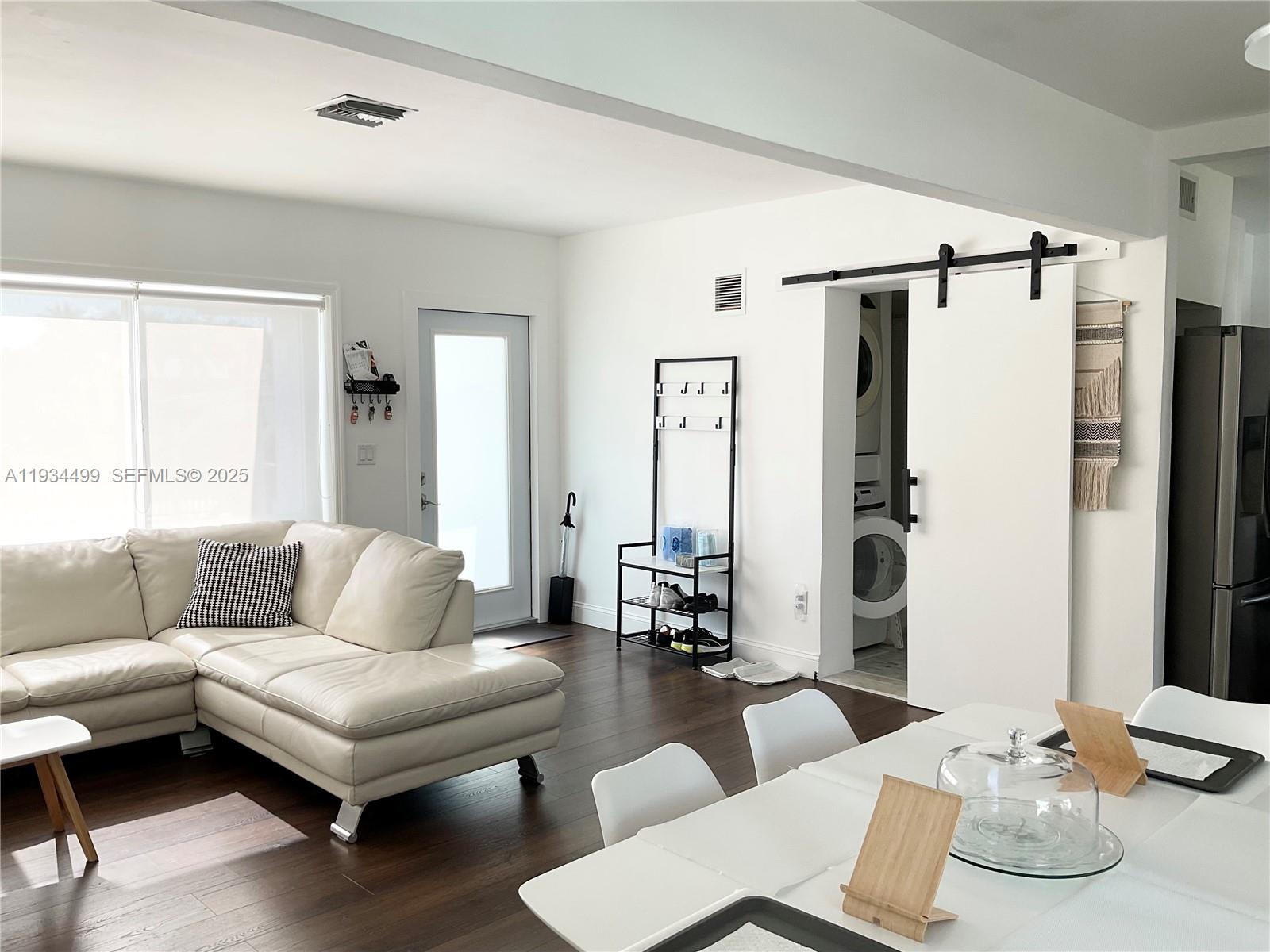 161 Northwest 145th Street Miami, FL 33168 - Photo 5 of 39 a living room with furniture and a large window