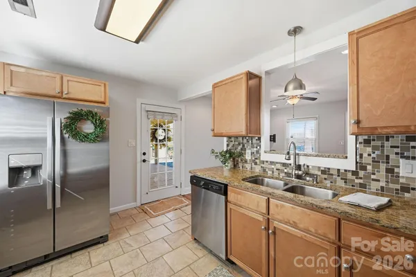 a bathroom with a sink a mirror and a shower