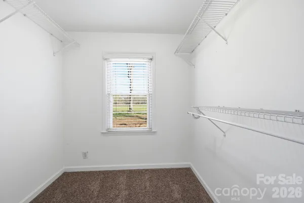 a front view of a house with a yard fire pit and outdoor seating