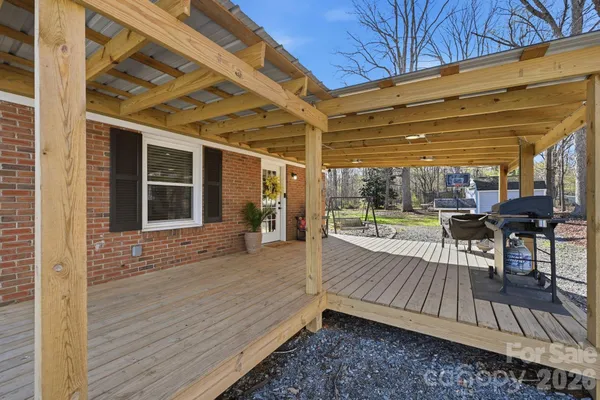 a view of a backyard with sitting area