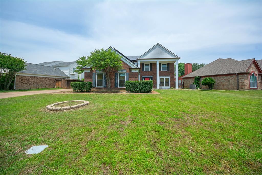 716 Bridget Way Hurst, TX 76054 - Photo 1 of 19 a front view of a house with garden