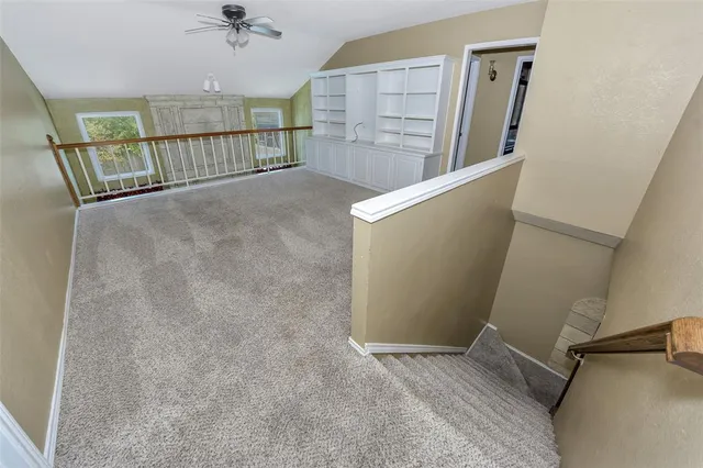 a view of a hallway with staircase