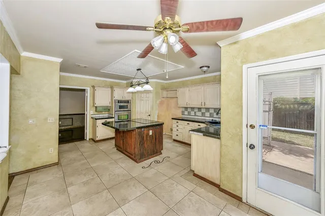 a kitchen with a refrigerator and a sink