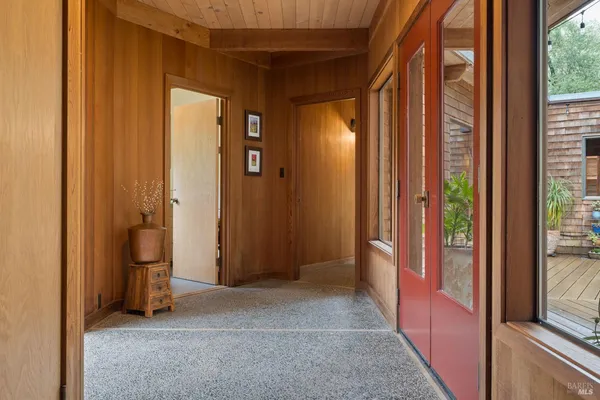 a view of an empty room and a window