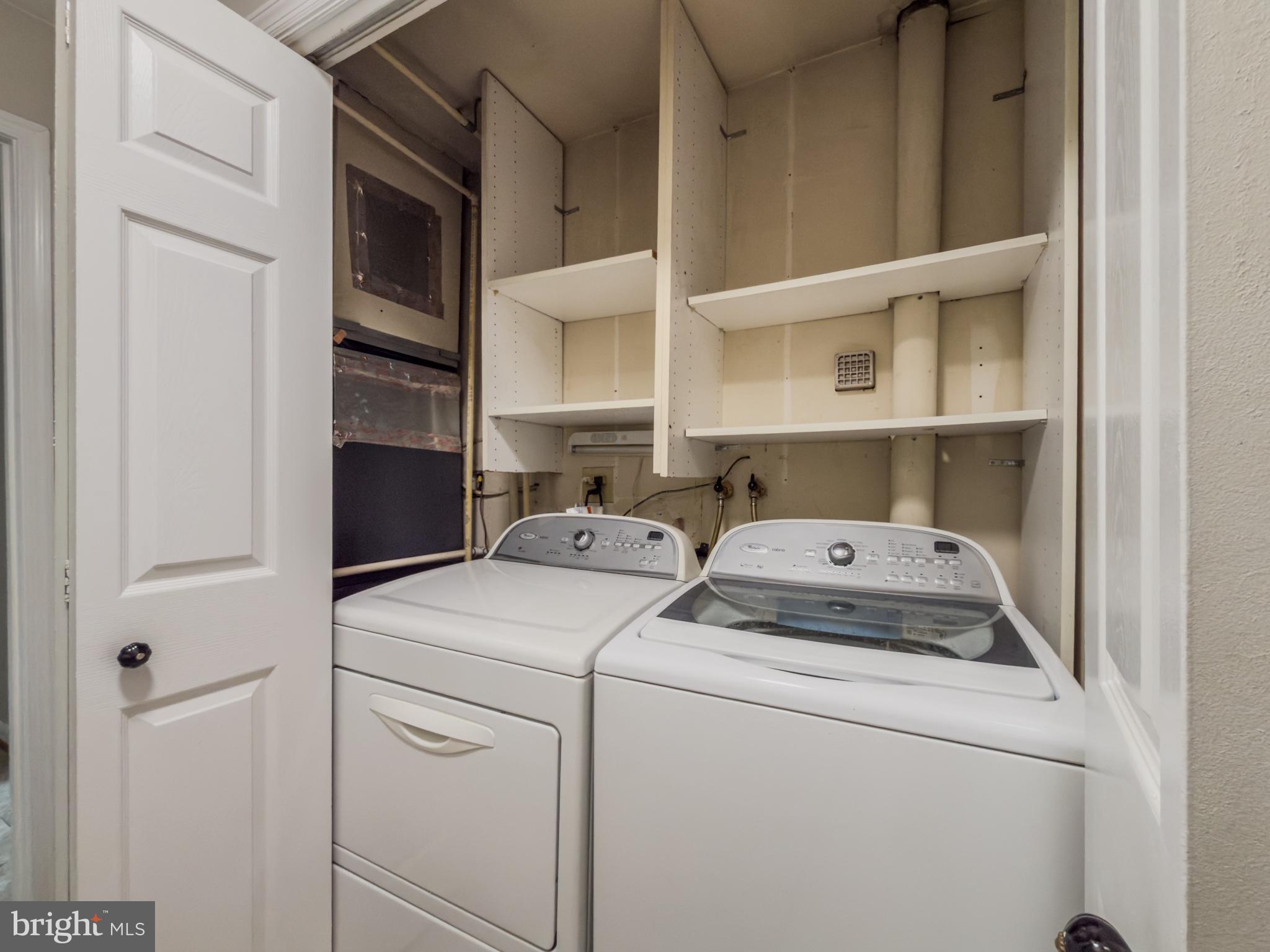 14900 Hydrus Road Silver Spring, MD 20906 - Photo 18 of 33 Efficient laundry space with storage.