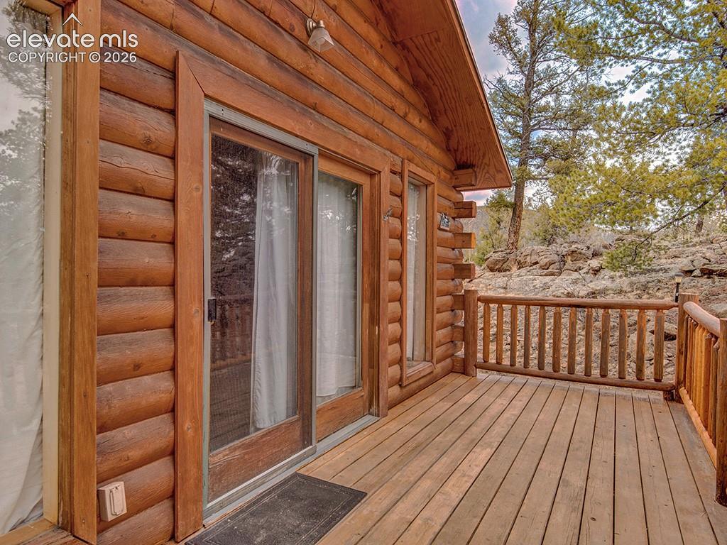 1462 Pulver Road Lake George, CO 80827 - Photo 2 of 25 a view of balcony with wooden floor