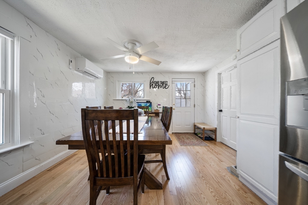 294 Whalom Road Lunenburg, MA 01462 - Photo 14 of 32 a view of a dining room with furniture window and wooden floor