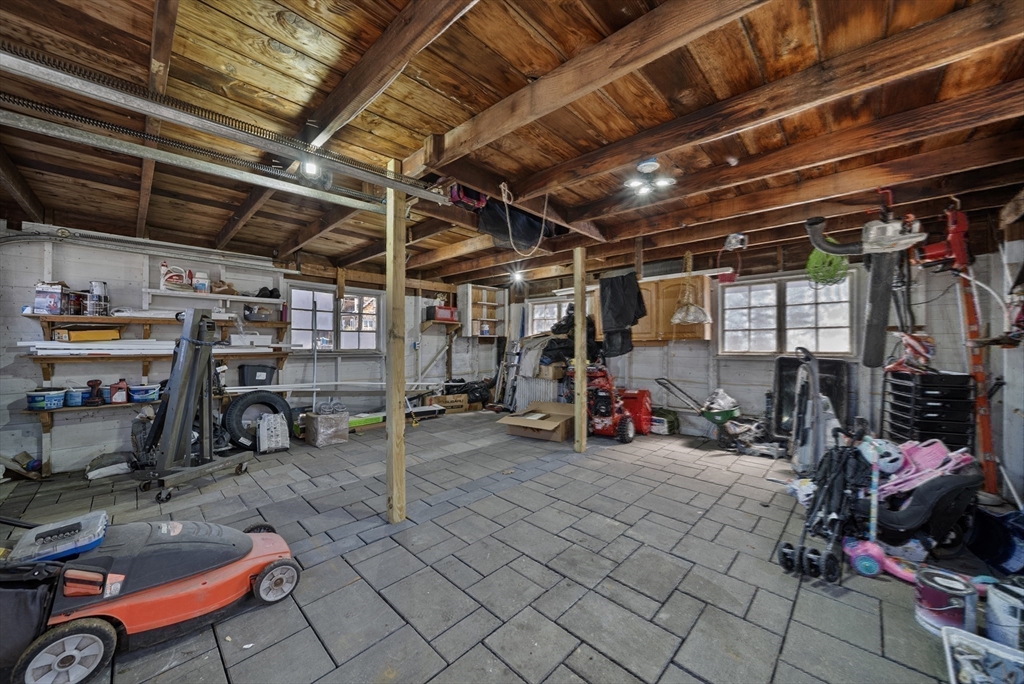 294 Whalom Road Lunenburg, MA 01462 - Photo 24 of 32 a view of a storage room with racks