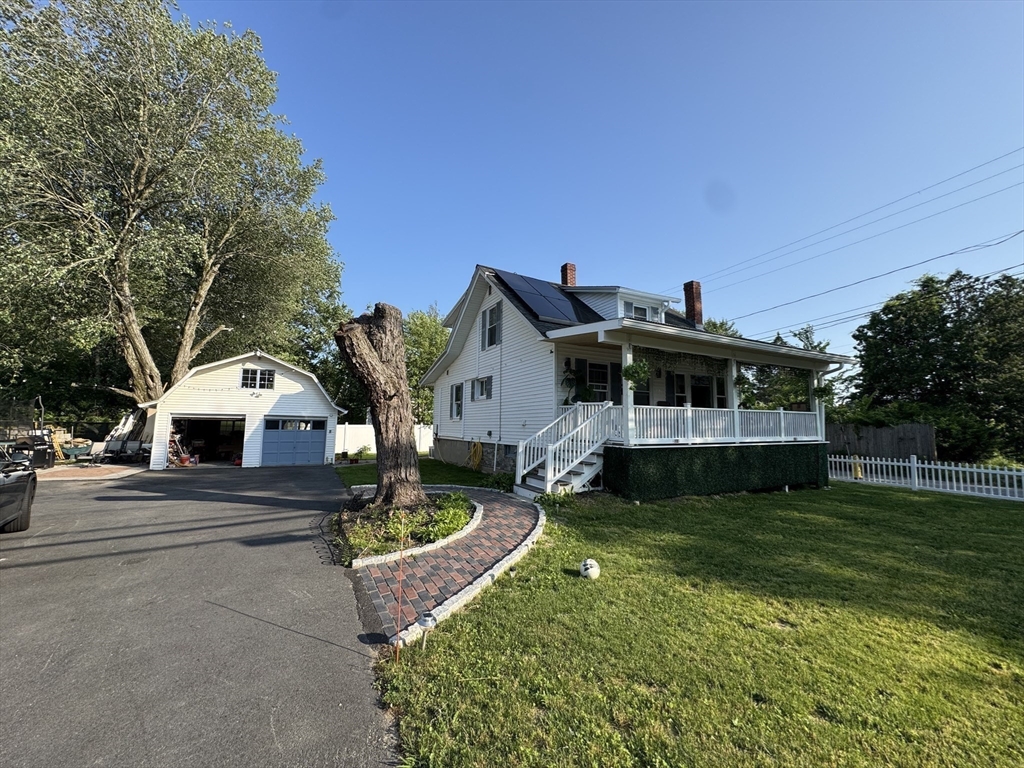 294 Whalom Road Lunenburg, MA 01462 - Photo 26 of 32 a front view of a house with a yard