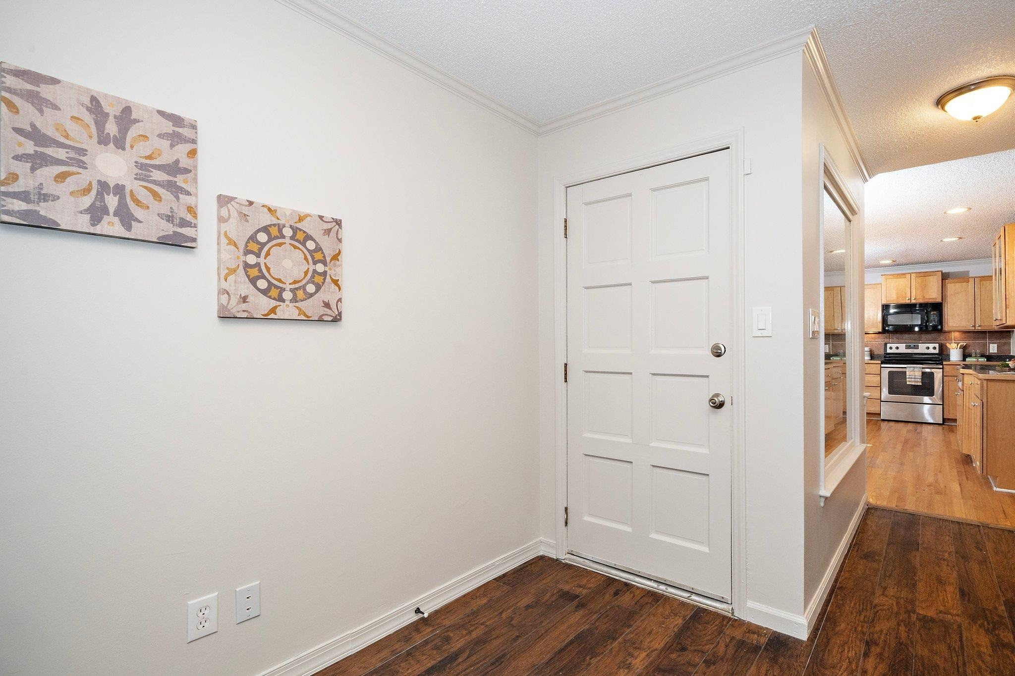 6304 Rushingbrook Drive Raleigh, NC 27612 - Photo 11 of 51 an empty room with wooden floor