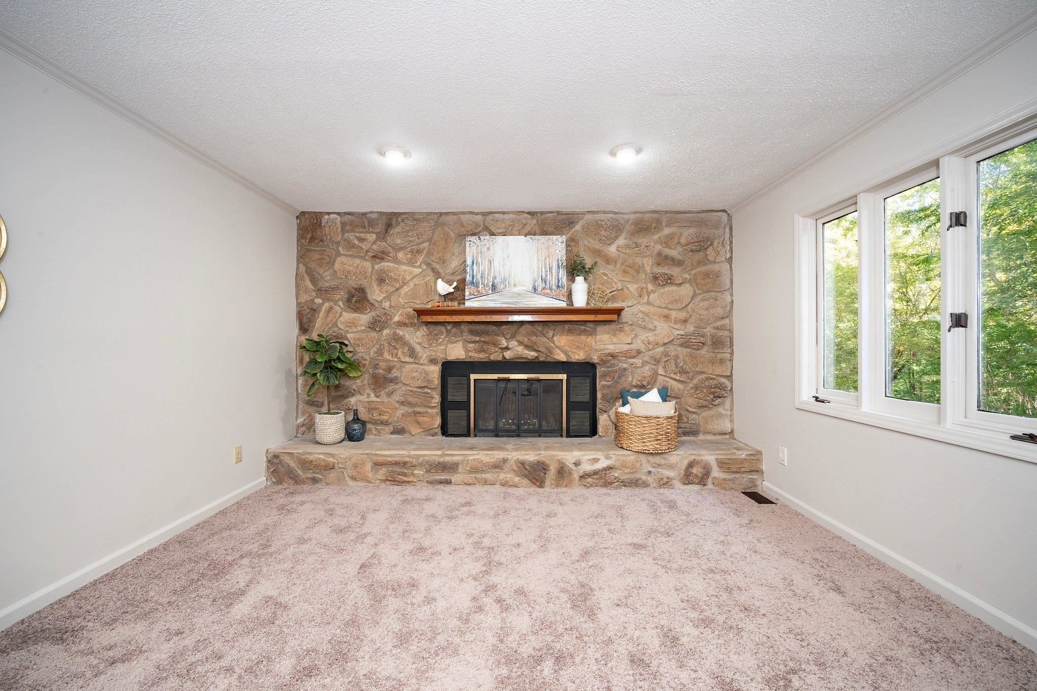 6304 Rushingbrook Drive Raleigh, NC 27612 - Photo 18 of 51 a view of a fireplace in a room