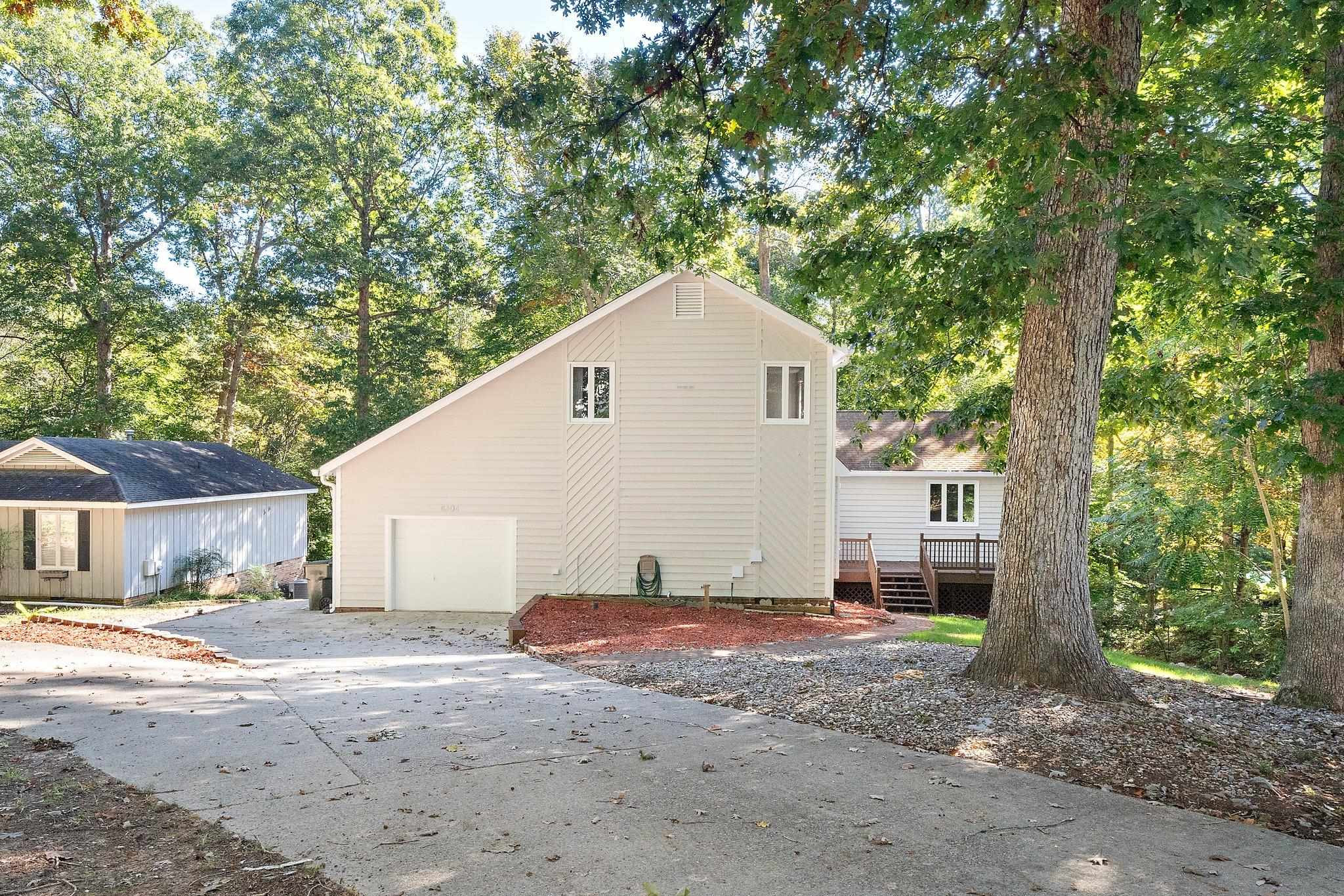 6304 Rushingbrook Drive Raleigh, NC 27612 - Photo 2 of 51 a view of a house with a backyard