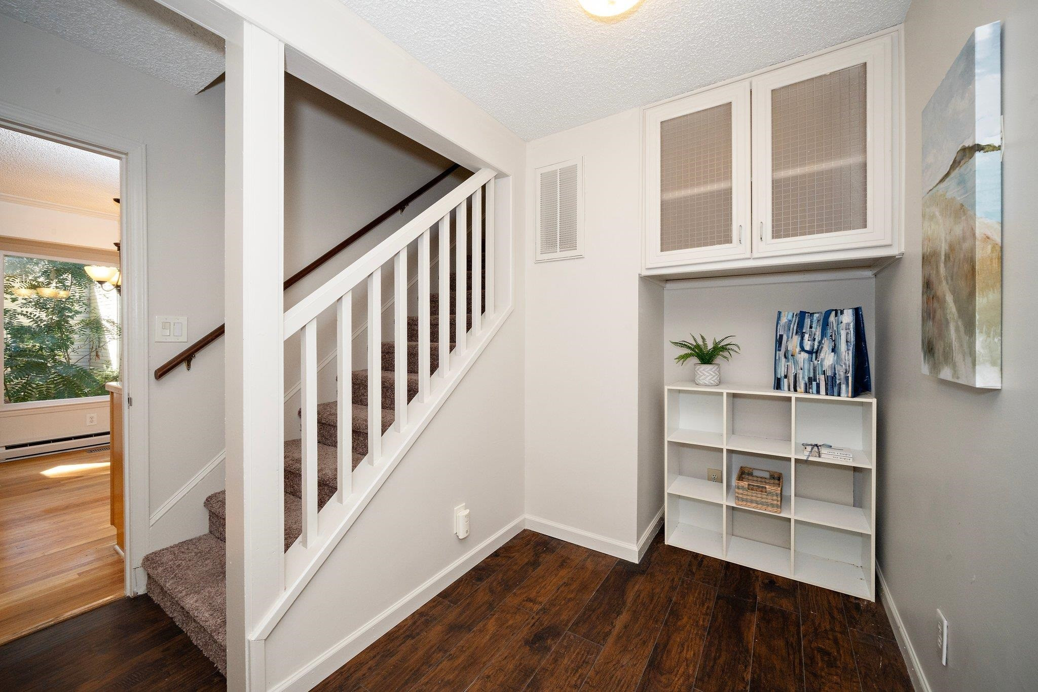 6304 Rushingbrook Drive Raleigh, NC 27612 - Photo 23 of 51 a view of an entryway with wooden floor and windows
