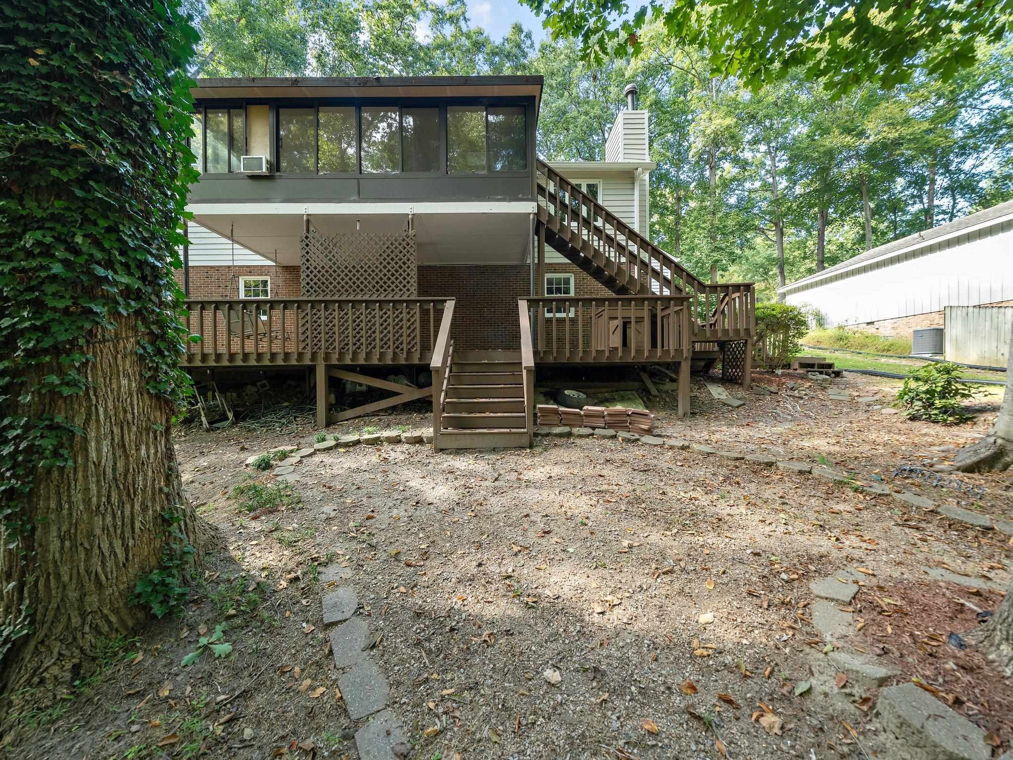 6304 Rushingbrook Drive Raleigh, NC 27612 - Photo 28 of 51 a house with trees in front of it