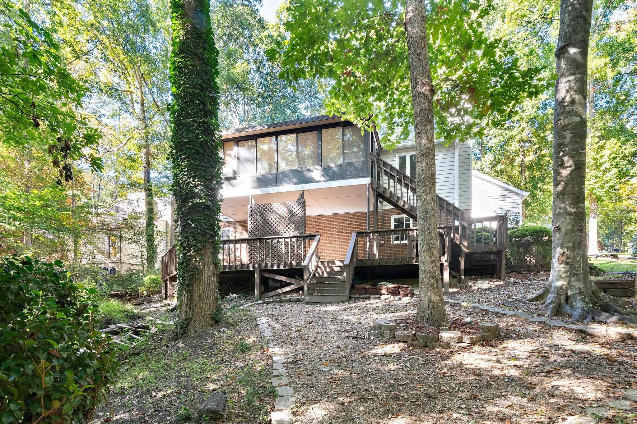 6304 Rushingbrook Drive Raleigh, NC 27612 - Photo 33 of 51 a view of a house with a tree in the yard