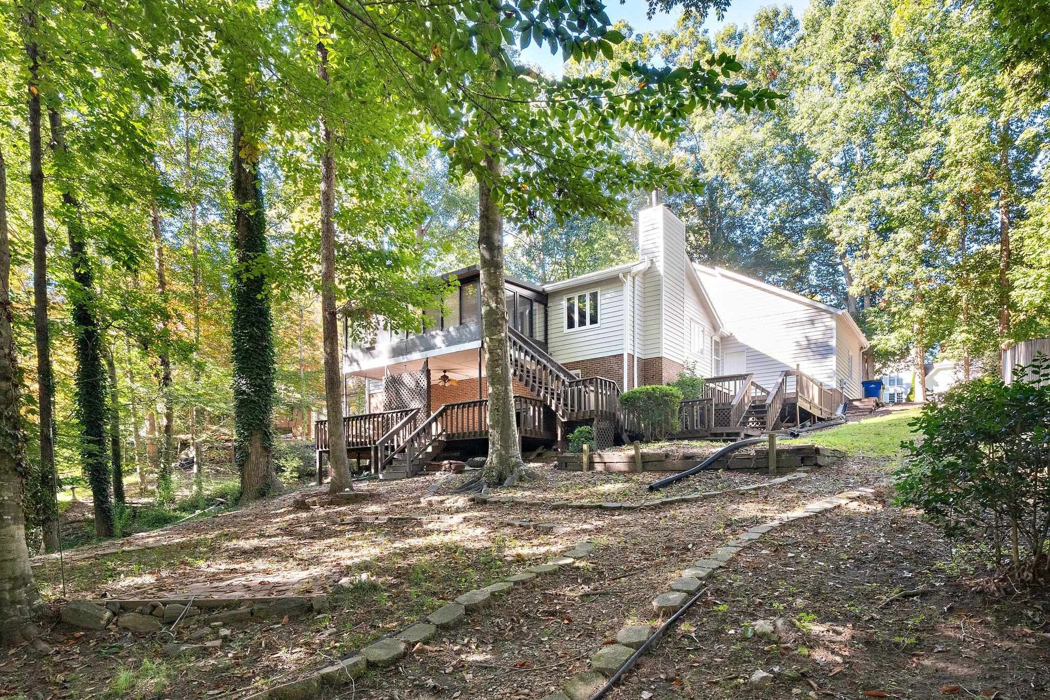 6304 Rushingbrook Drive Raleigh, NC 27612 - Photo 34 of 51 a front view of a house with a yard