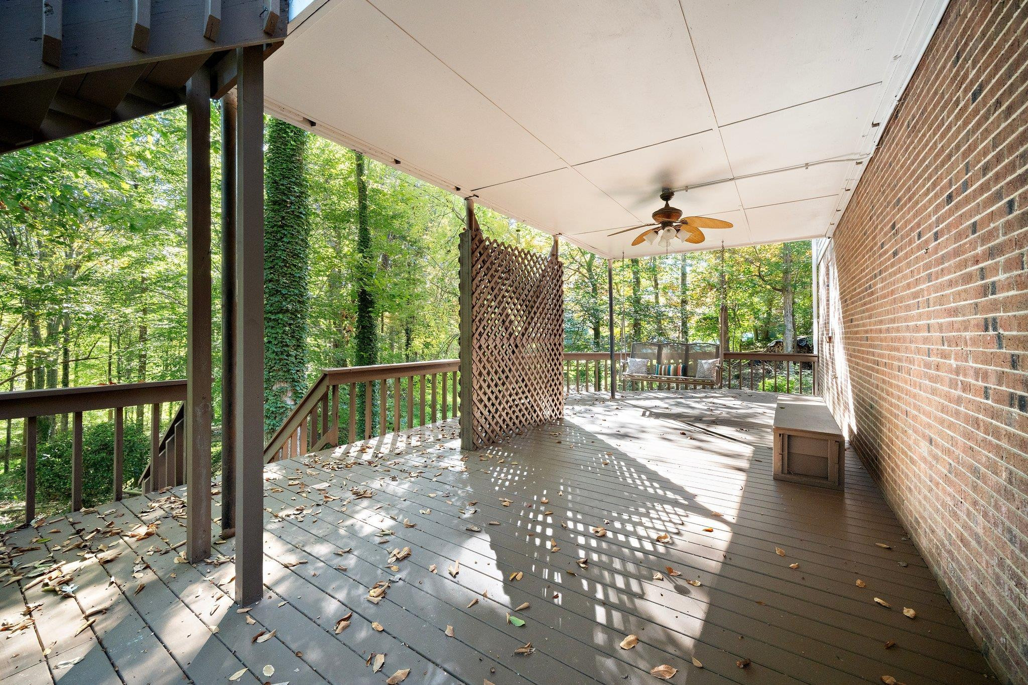 6304 Rushingbrook Drive Raleigh, NC 27612 - Photo 36 of 51 a view of a porch with wooden floor and outdoor space