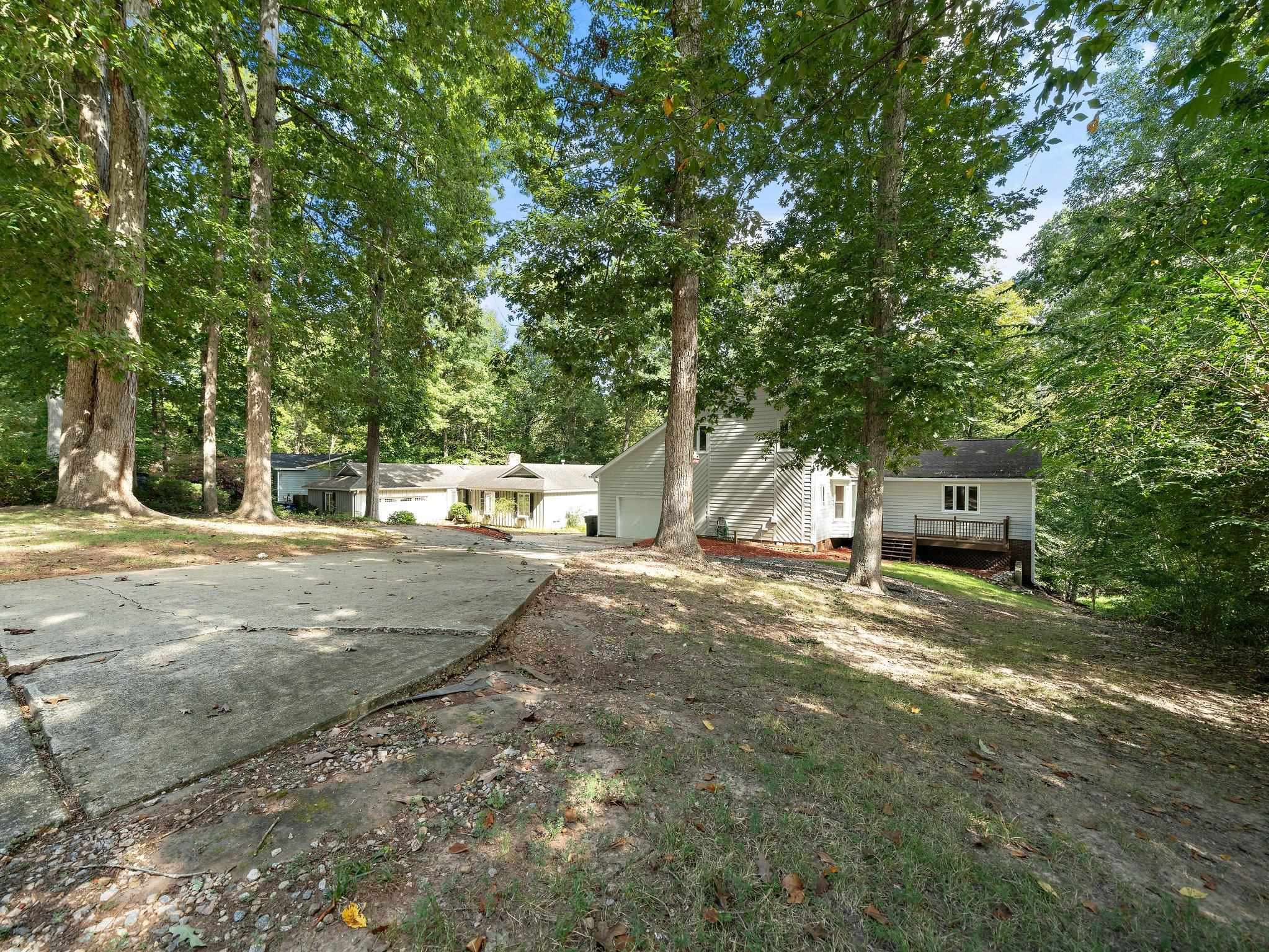 6304 Rushingbrook Drive Raleigh, NC 27612 - Photo 4 of 51 a view of a yard with large trees