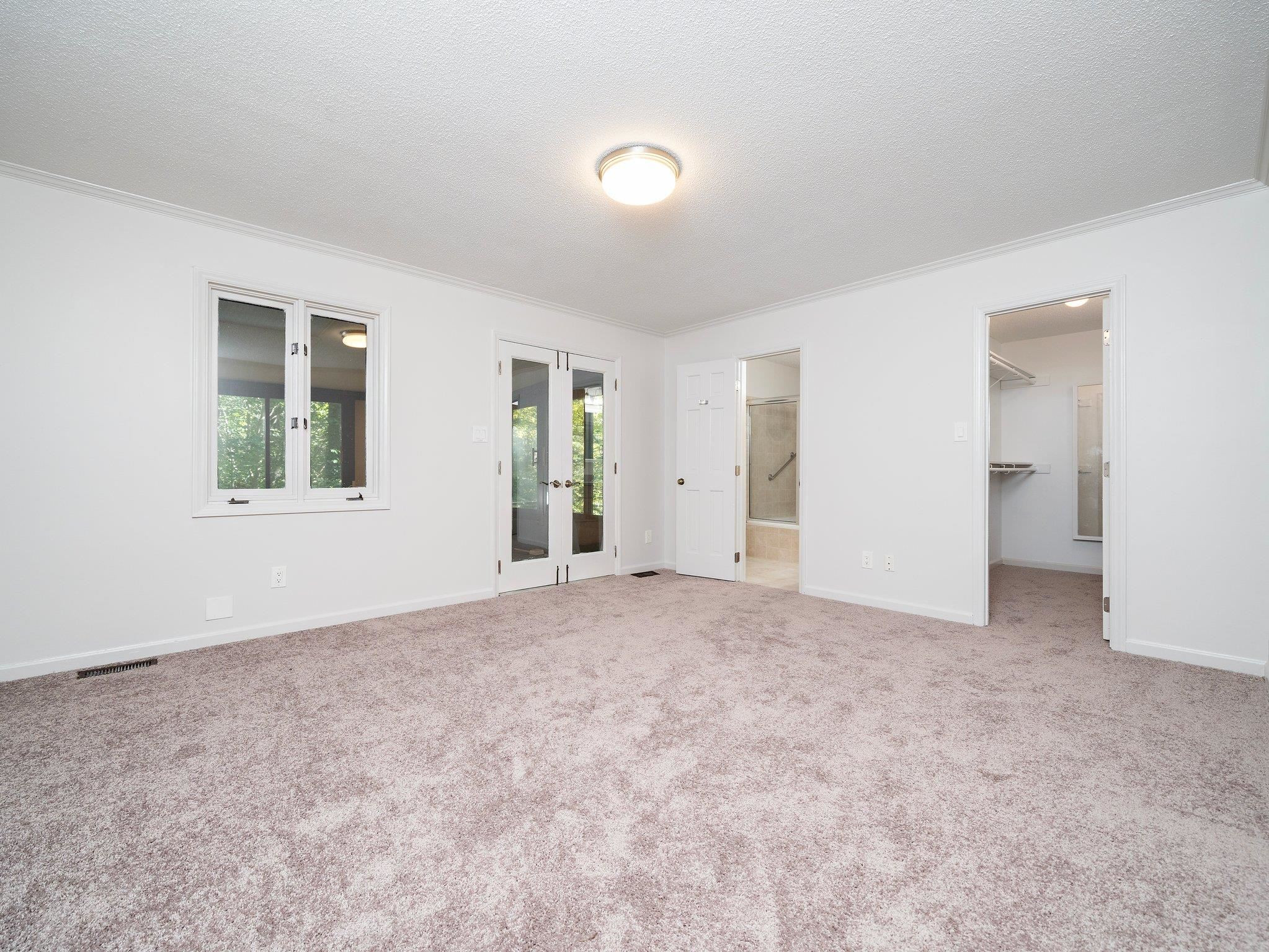 6304 Rushingbrook Drive Raleigh, NC 27612 - Photo 42 of 51 a view of an empty room with a window