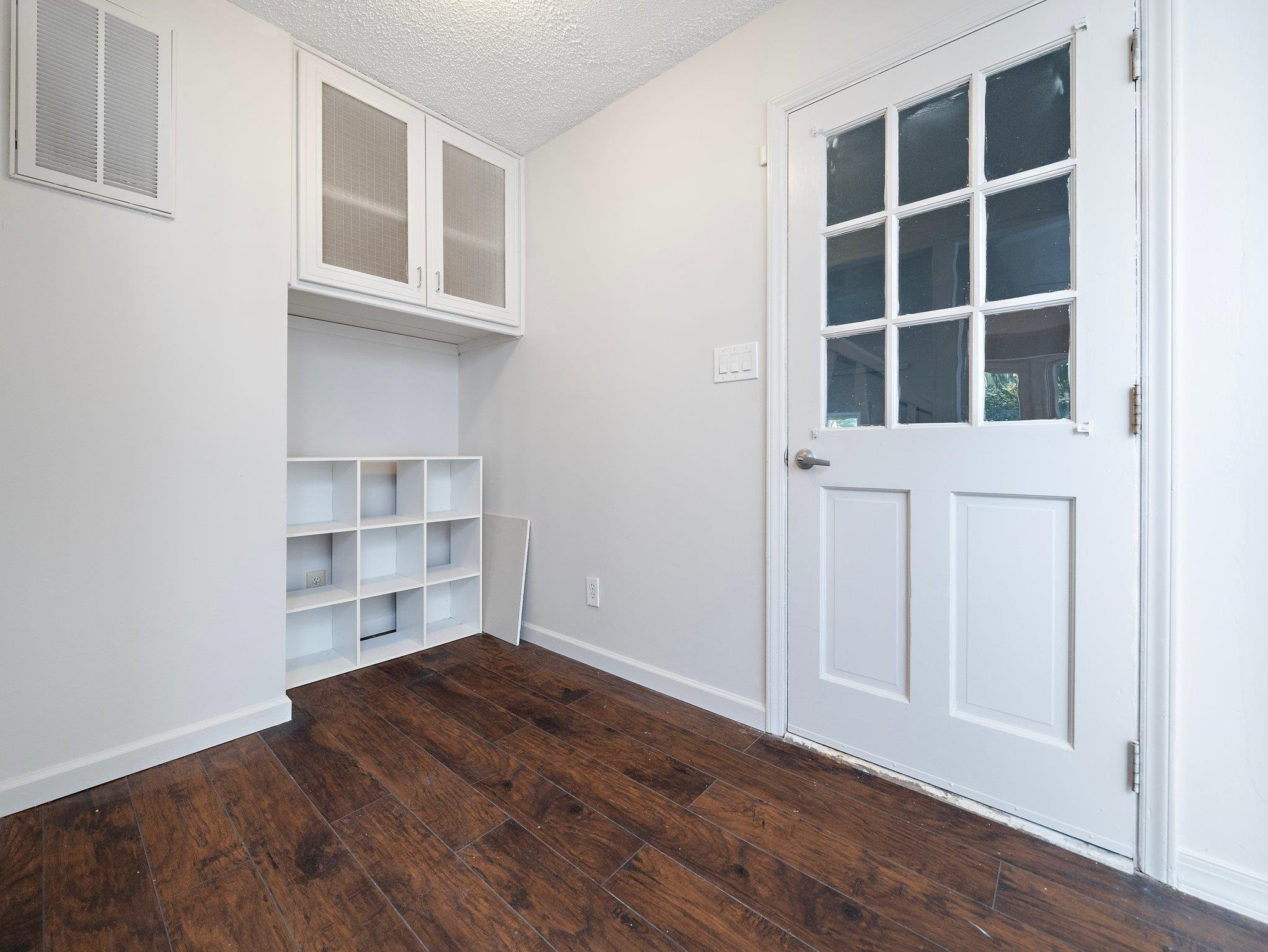6304 Rushingbrook Drive Raleigh, NC 27612 - Photo 46 of 51 a view of empty room with wooden floor and windows