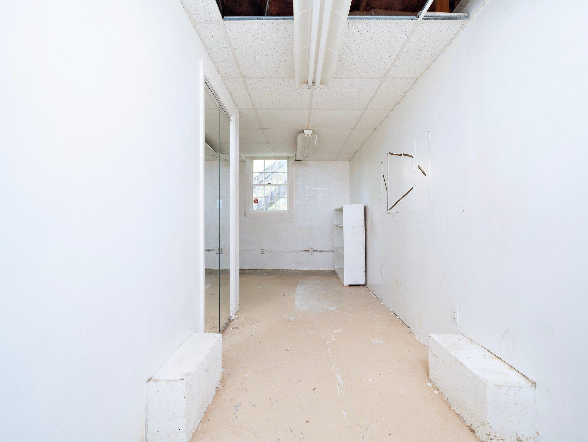 6304 Rushingbrook Drive Raleigh, NC 27612 - Photo 48 of 51 a view of a room with a hallway