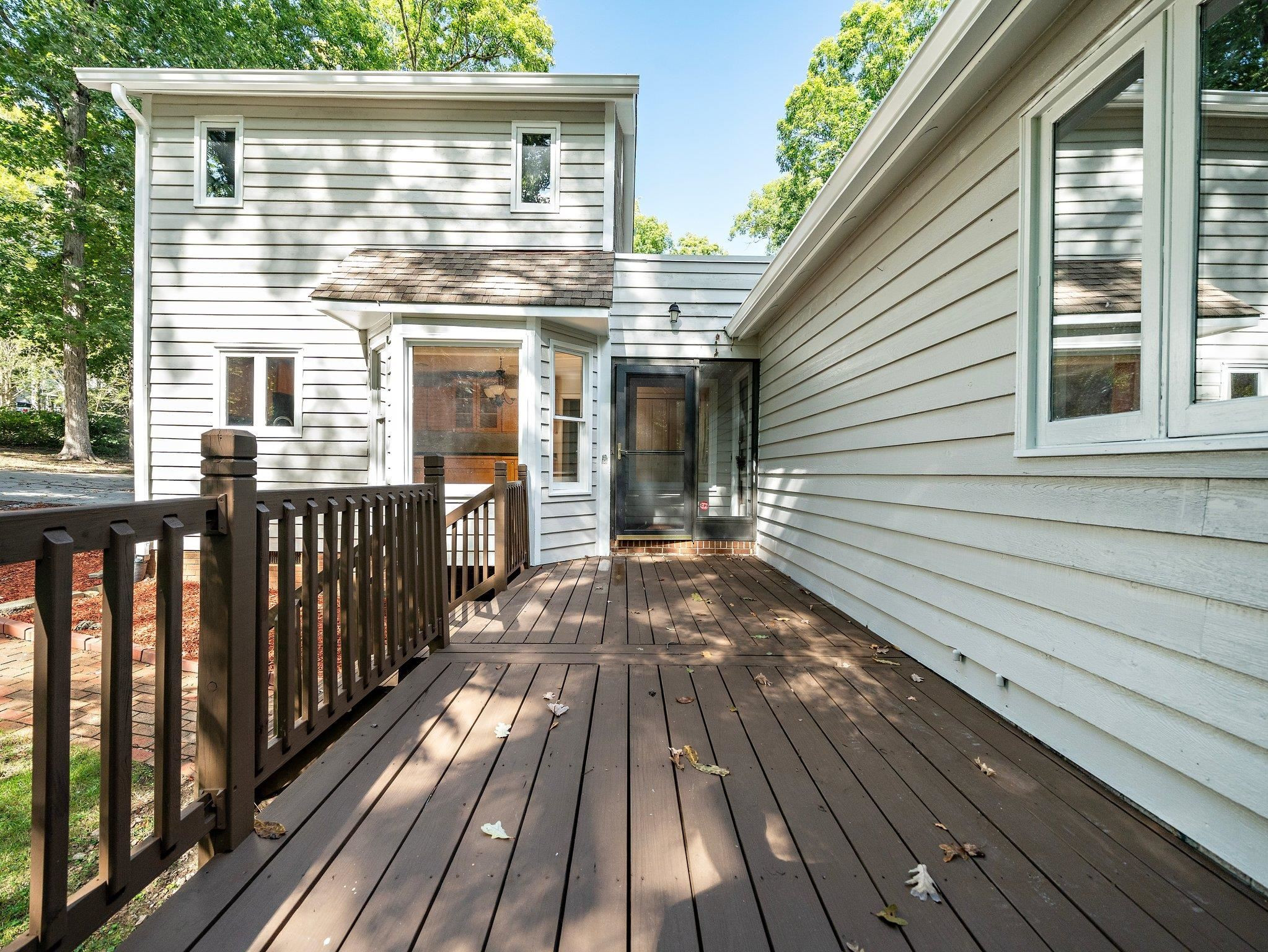 6304 Rushingbrook Drive Raleigh, NC 27612 - Photo 10 of 51 a view of a wooden deck with a yard