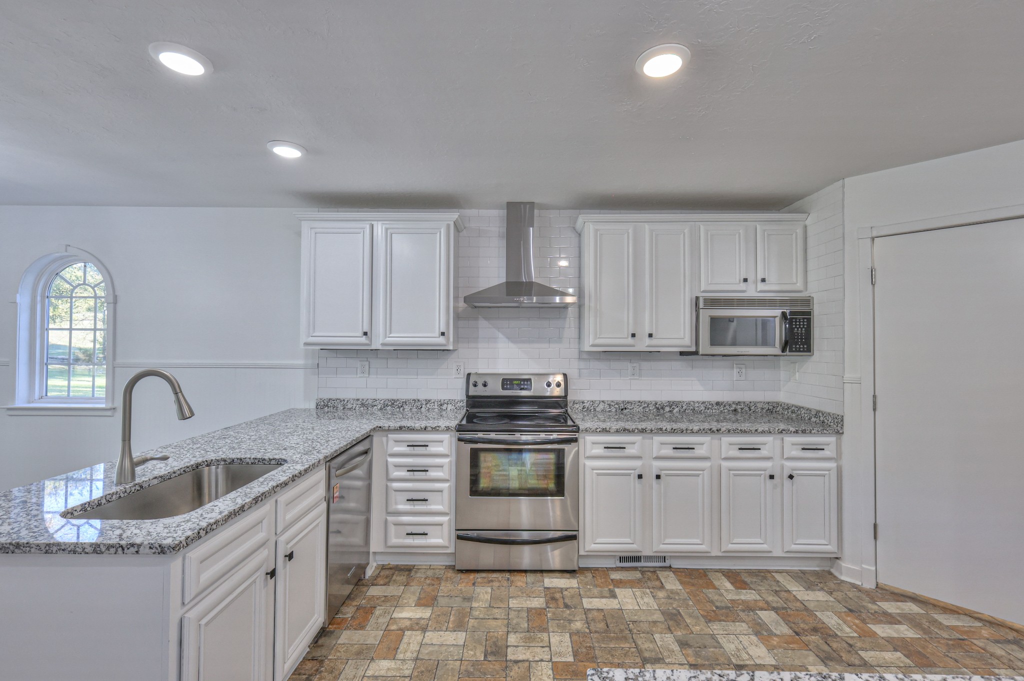 1380 Haley Road Watertown, TN 37184 - Photo 18 of 95 a kitchen with stainless steel appliances granite countertop a stove sink and cabinets