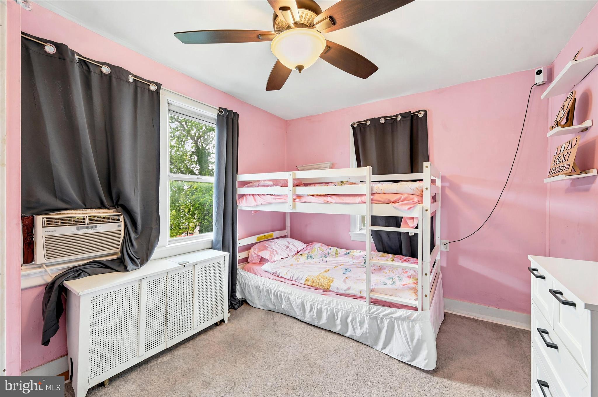 1210 Harding Drive Havertown, PA 19083 - Photo 16 of 25 a bedroom with a bed flat screen tv and a window