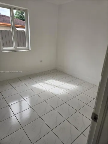 a view of a room and window