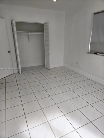 a view of a room with a large window