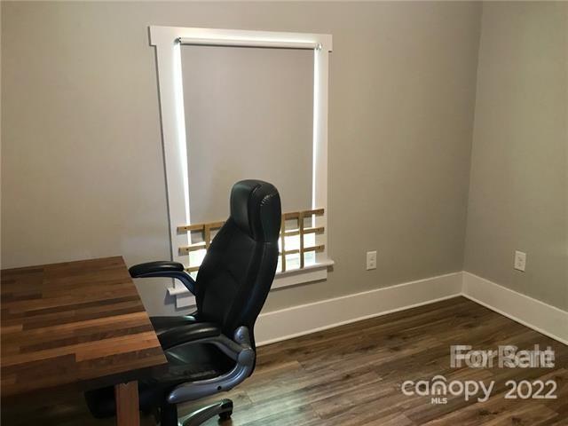 31 Banks Town Road Weaverville, NC 28787 - Photo 12 of 22 a view of a workspace with furniture and wooden floor
