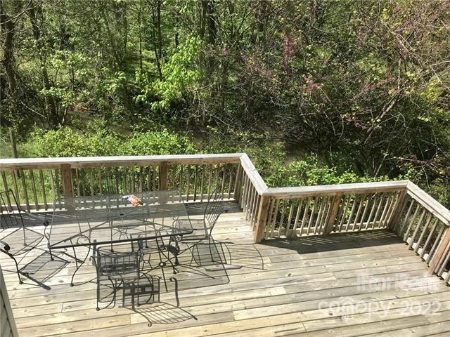 31 Banks Town Road Weaverville, NC 28787 - Photo 19 of 22 a view of balcony with wooden floor and outdoor seating