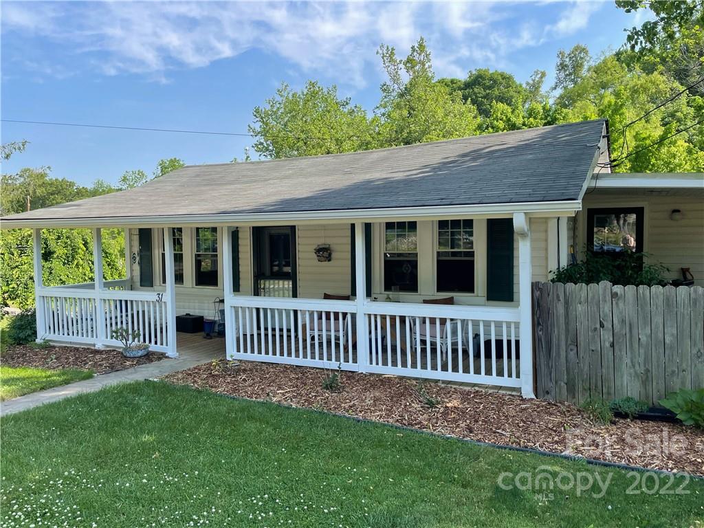 31 Banks Town Road Weaverville, NC 28787 - Photo 2 of 22 a view of a house with a yard and a garden