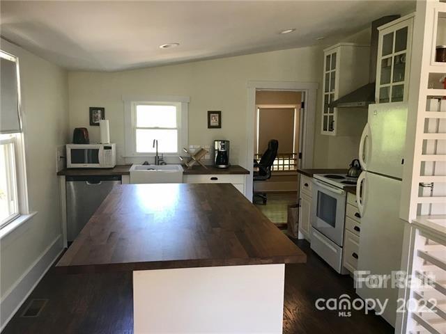 31 Banks Town Road Weaverville, NC 28787 - Photo 7 of 22 a kitchen with kitchen island a counter appliances a sink and cabinets