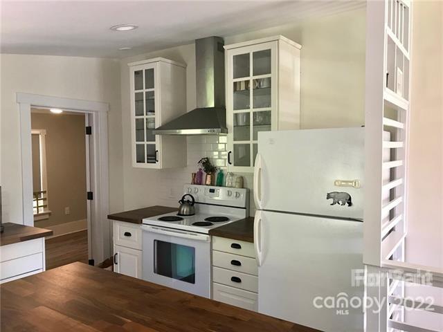 31 Banks Town Road Weaverville, NC 28787 - Photo 9 of 22 a kitchen with stainless steel appliances granite countertop a stove and a refrigerator
