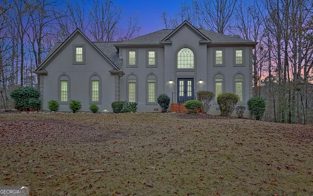 a front view of a house with garden