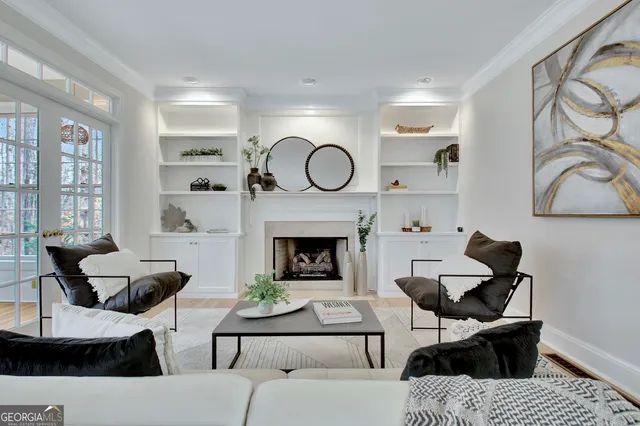 a kitchen with granite countertop white cabinets and window
