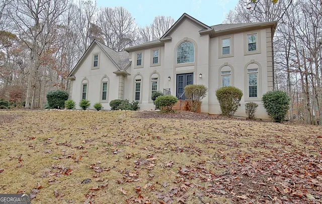 a front view of a house with a yard