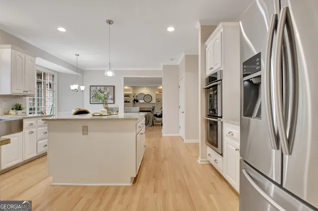 a view of a livingroom with wooden floor and a window