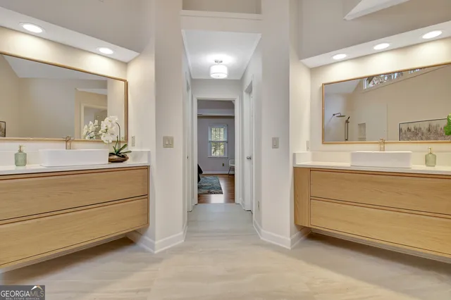 a front view of a house with a yard and green space