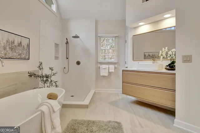 a view of a house with a small yard and plants