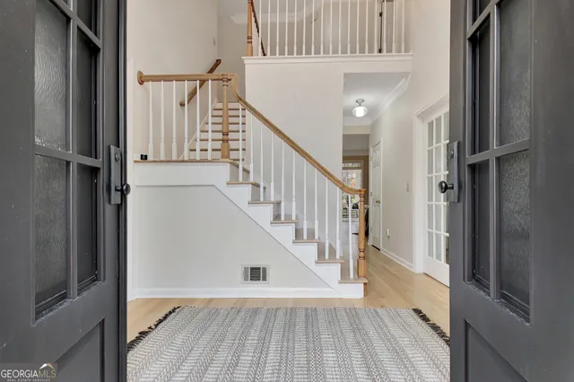 a bathroom with a sink vanity and mirror